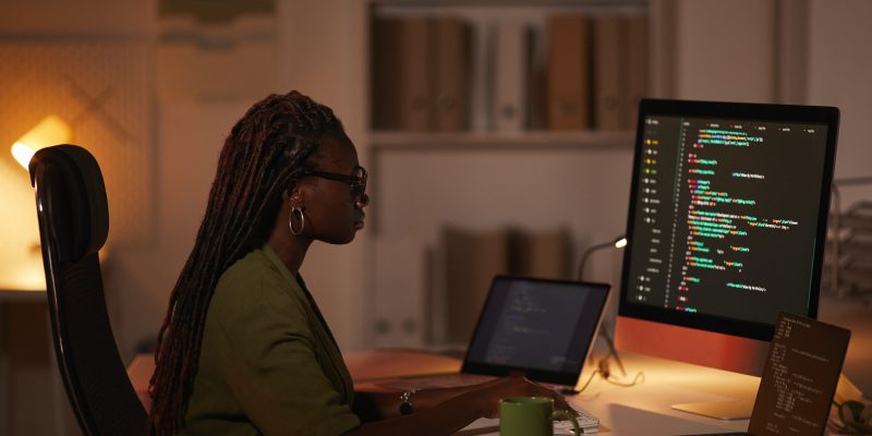 African-American Woman Writing Computer Code