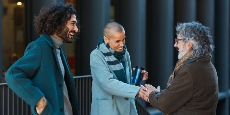 Professional business people talking and meeting on the street